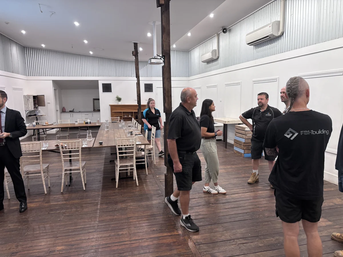 Members chatting in the meeting room at The Woolshed